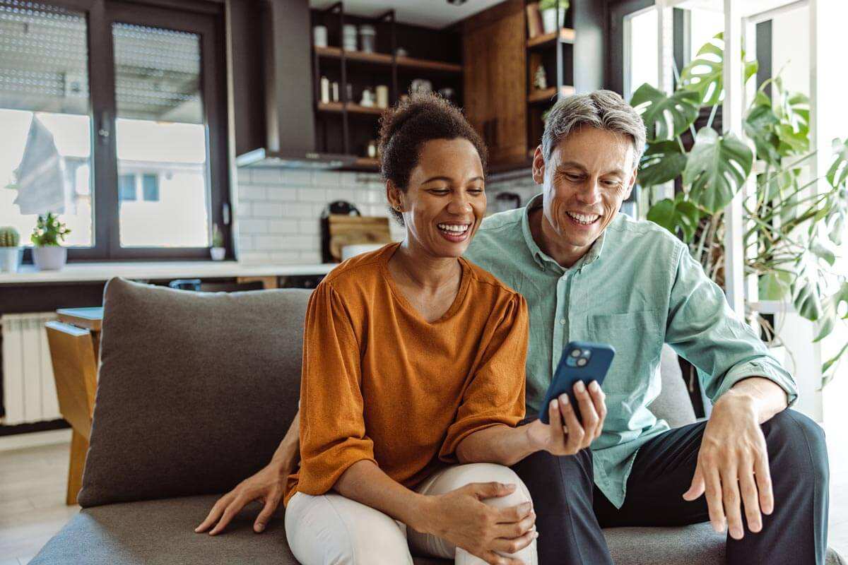 A mid-aged couple using fast internet service in New Lisbon by NLBC
